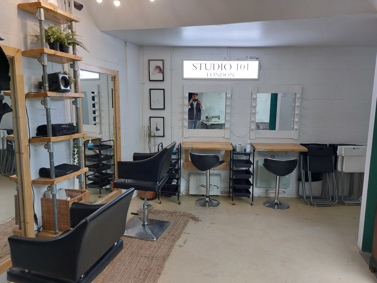 beauty salon with Derek and sowing machine reflected in make up mirror