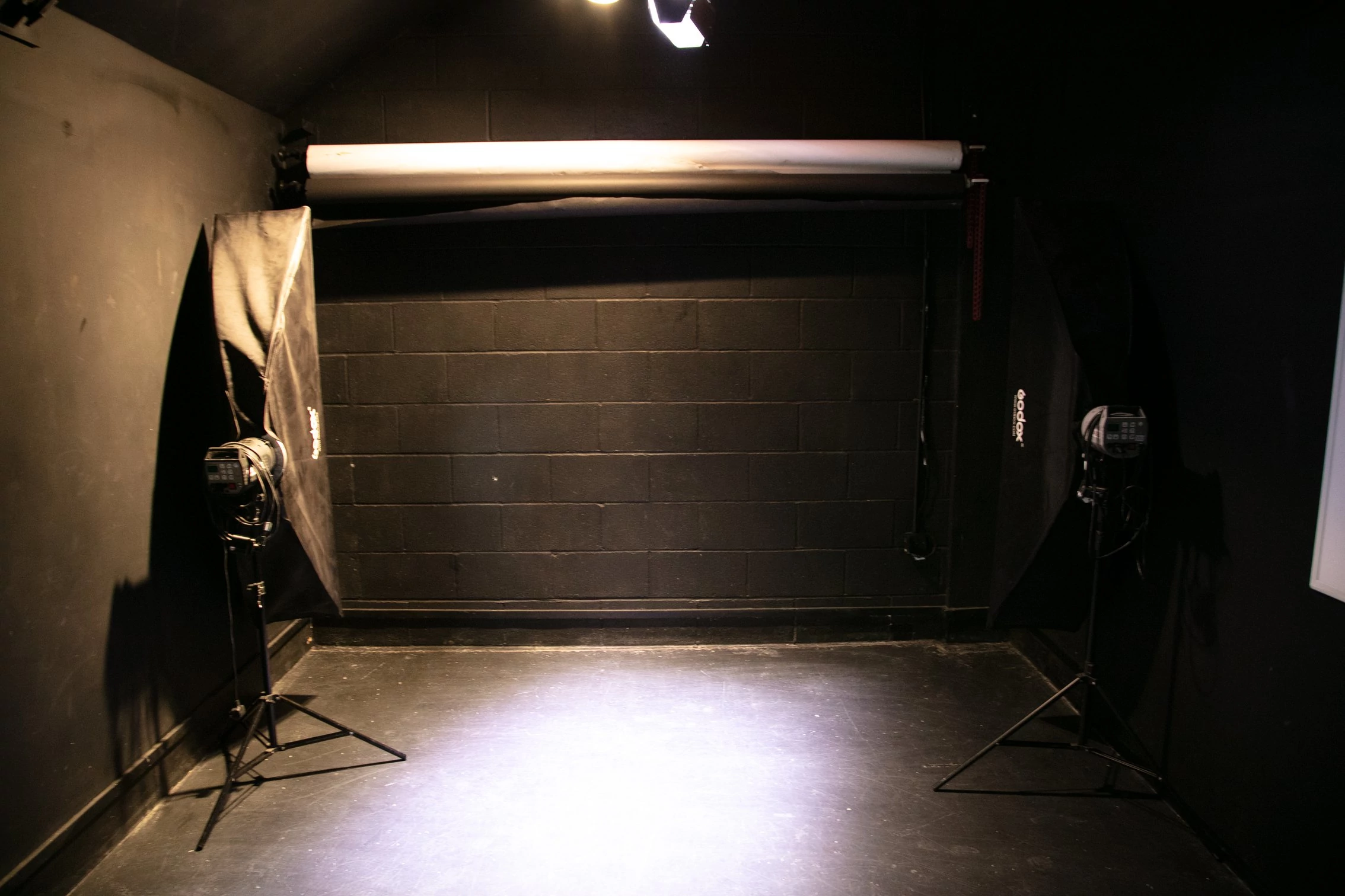 black video studio overhead spot lighting 