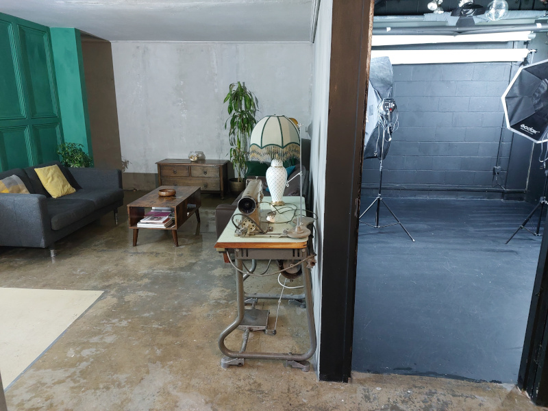 lounge_cement_and_green_panel_walls_and black_studio
